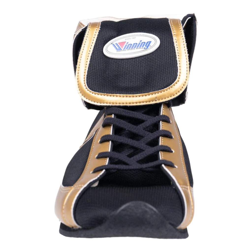 Close-up of Winning Mid-Cut FOLD Type boxing boot showing black and gold construction, laces and oval Winning patch