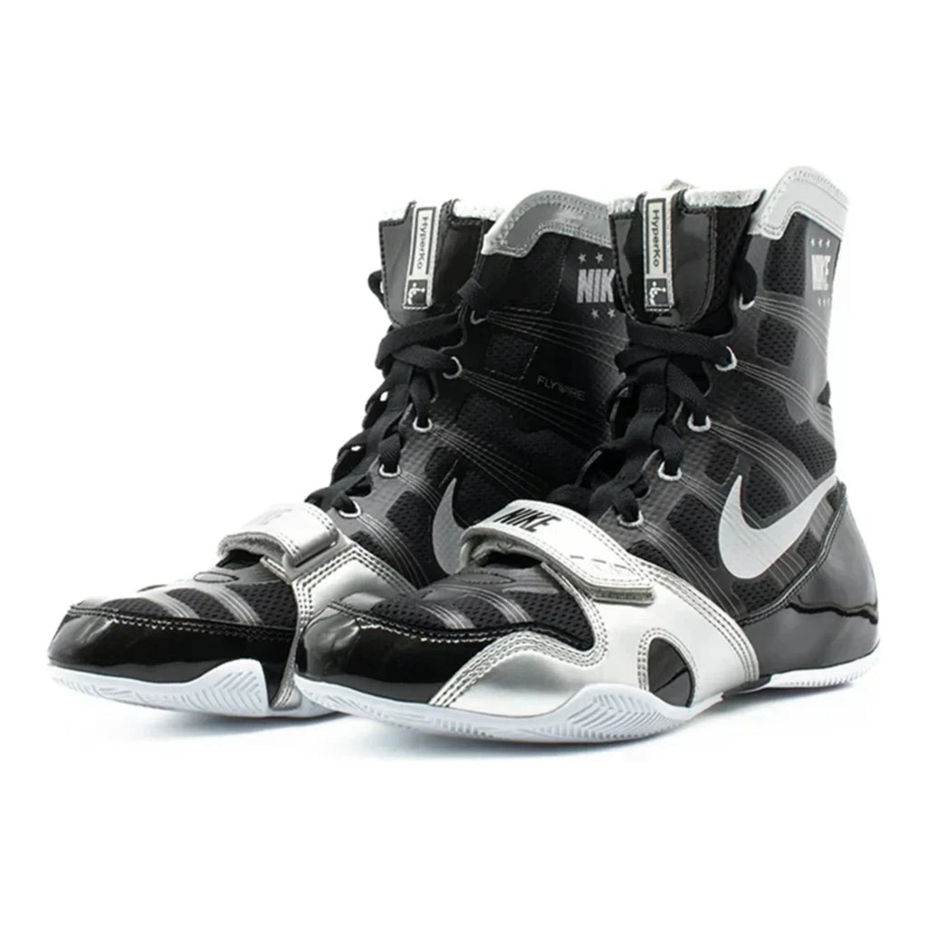 Pair of Nike HyperKO 1 boxing shoes in black and metallic silver with midfoot straps and high-top collars